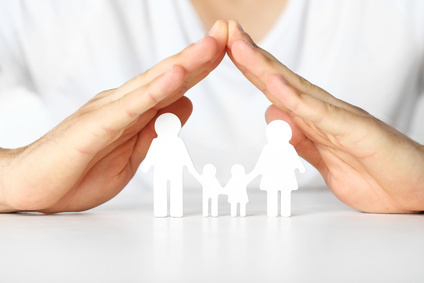 Figurine of family in male hands, closeup