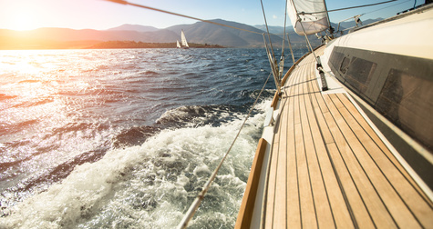 Yacht sailing towards the sunset